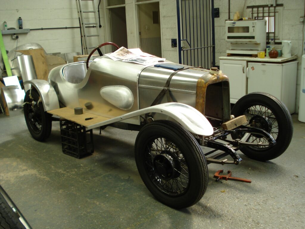 Photograph of A3 in the later stages of restoration. The car is stripped back to bare metal but is starting to look like a car