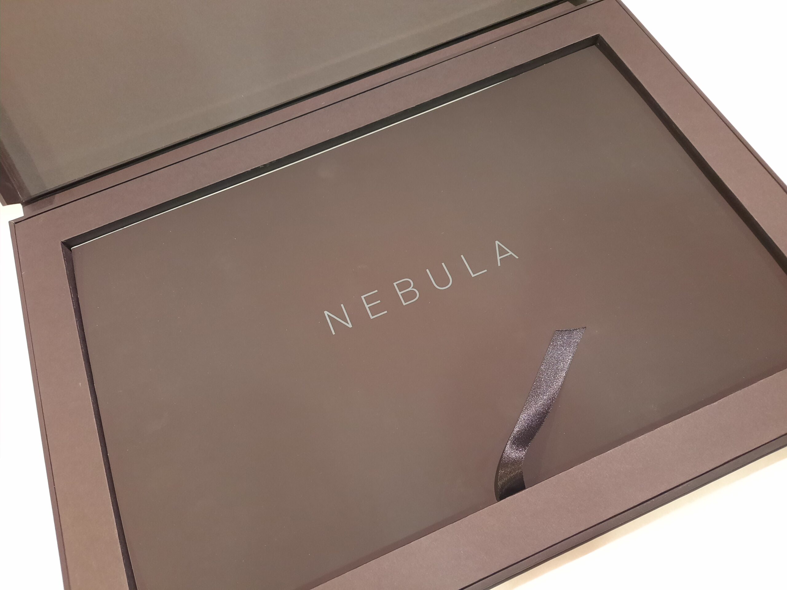 Image shows the Nebula Collaboration Presentation Box, a large black rectangle with an internal rectangular space for large cards about the Nebula Collaboration