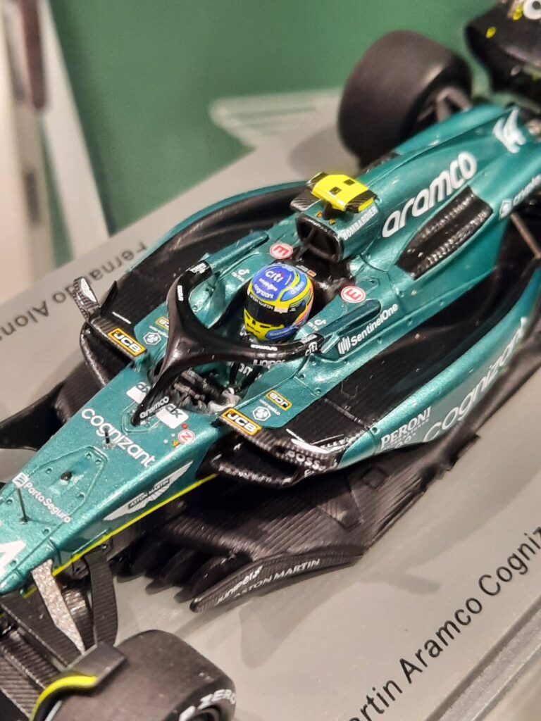 Close up image of the AMR23 scale model and the model driver with helmet