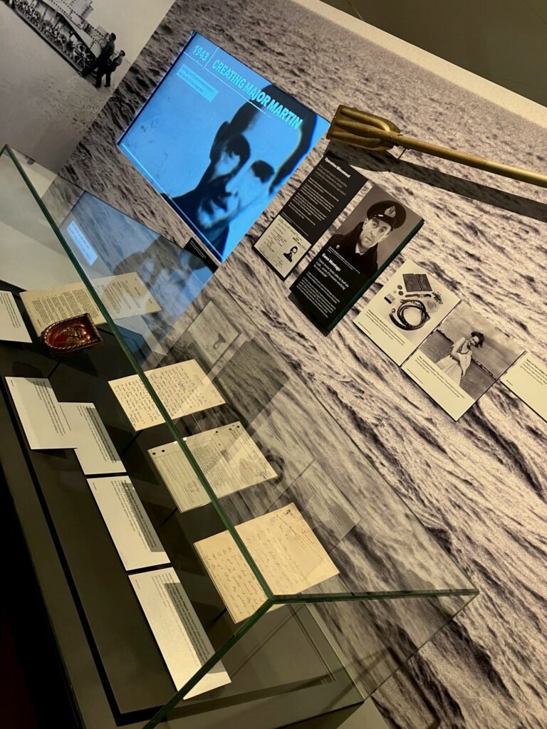 Image of information boards and display case with original documents for Operation Mincemeat